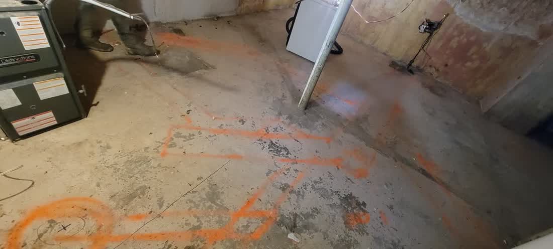 Cutting a trench in a basement slab — real job site