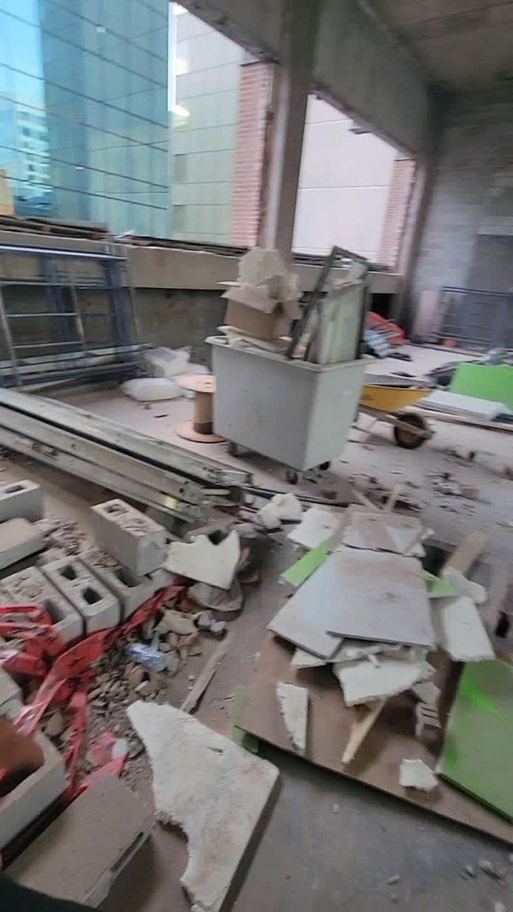 Concrete wall demolition on the 14th floor of a building